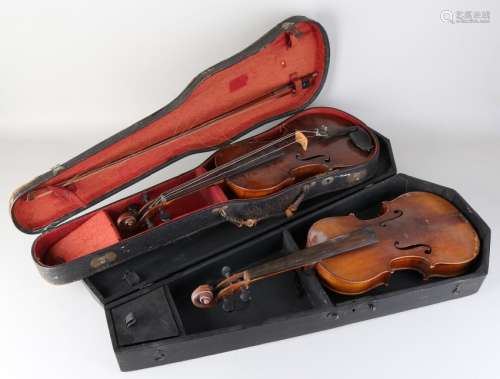 Two old / antique violins in storage cases. One