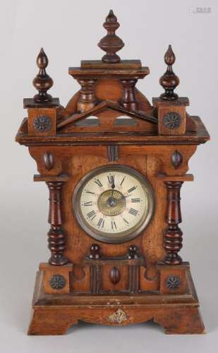 Antique German walnut table clock with alarm clock.