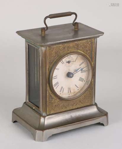 Antique nickel-plated travel alarm clock. Circa 1900.