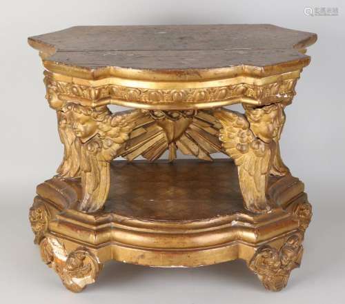 Early 19th century carved gilt console with caryatids.