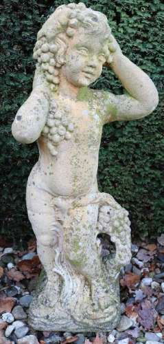 Old concrete cast garden image. Young man with grapes.