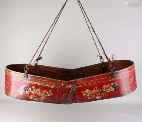 Antique Chinese wooden painted cradle with chains.