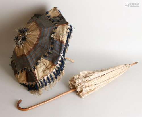 Two antique parasols. One time Japan with bone. Bamboo