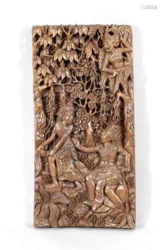 Old Indonesian carvings plaque. Three figures in the