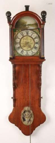 Antique oak Frisian tail clock with alarm clock.