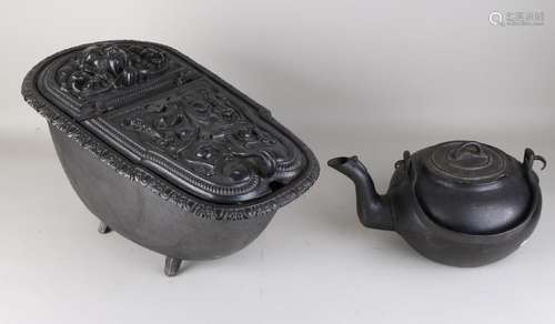 Cast iron coal kit with floral / lion head decor. And