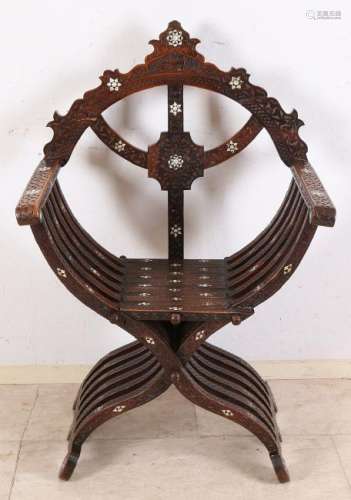 Antique North African scissor chair with carving and