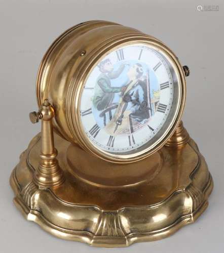 Old brass desk clock, depicting monkey shaves man. 20th