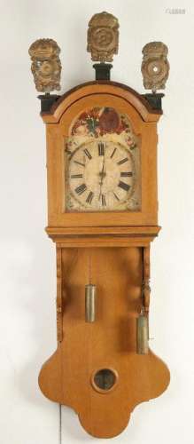 19th century tail clock with Schwarzwalder timepiece.