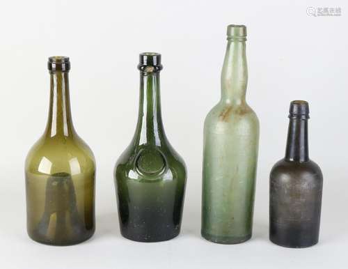 Four antique 18th - 19th century wine bottles.