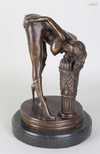 Bronze nude woman on black marble base. 21st century.