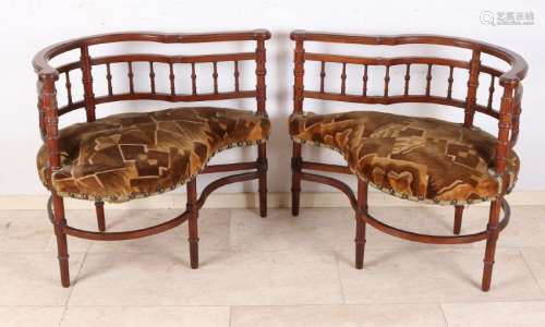 Two antique walnut partner chairs with bars. Circa