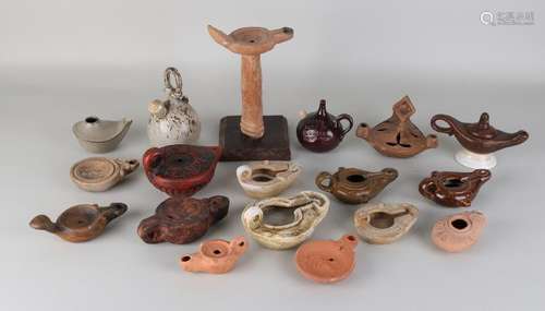 Eighteen times various ceramic oil lamps. 20th century.