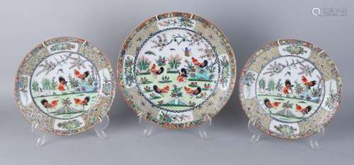 Three old Chinese porcelain plates with chicken decor.