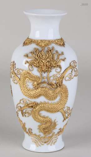 Chinese porcelain dragon vase with elaborate gold