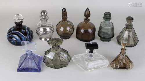 Ten different glass or crystal bottles in various