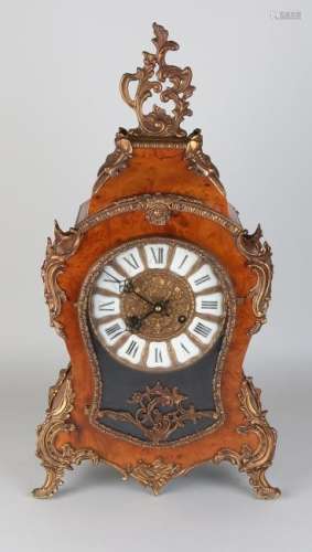 Old root-wood boulle table clock with bronze frames.