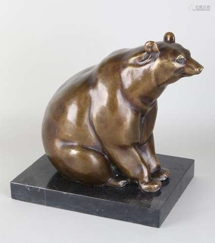 Bronze bear on black marble base. 21st century.