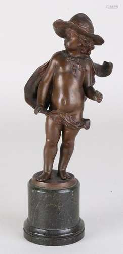 Antique bronze figure on black marble base. Gypsy boy