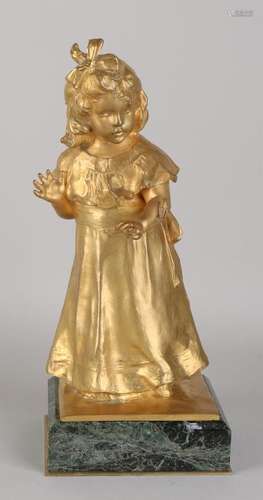 Large antique gilt bronze figure on black marble base.