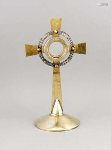Old gold-plated metal monstrance with relic holder.