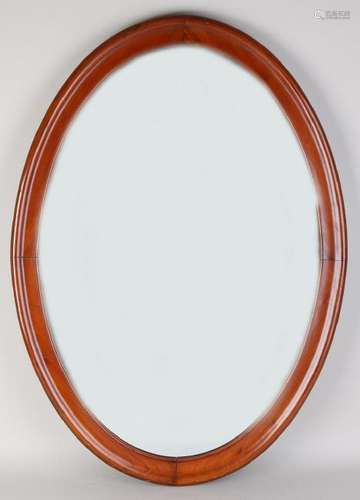 Antique oval mahogany mirror. Circa 1900. Dimensions: