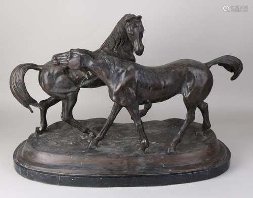 Large bronze group of figures on a black marble base.