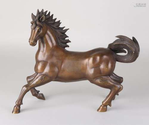 Bronze cast stallion. Brown patinated. 20th century.