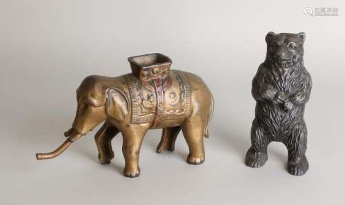 Two old cast-iron money boxes. Consisting of: Bear +