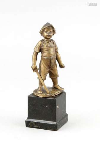 Antique bronze figure. Boy with toy sword on marble