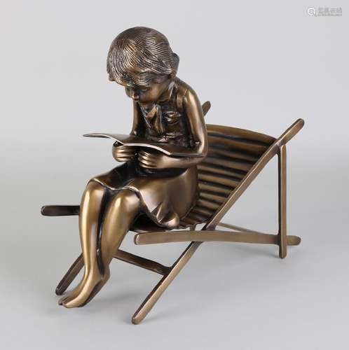 Bronze figure. Two-part. 21st century. Reading girl on