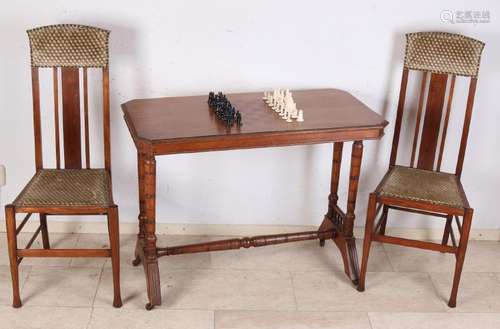 Antique walnut chess table with inlaid chess board.