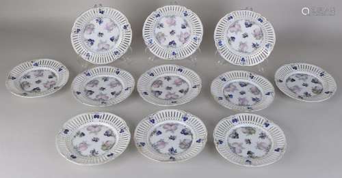 Eleven openwork porcelain pastry dishes with fruit