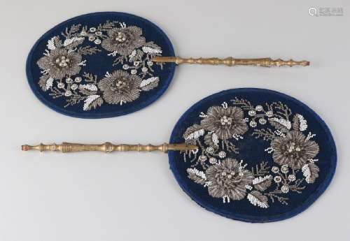 Two fire sides with embroidered beads and gilded wooden