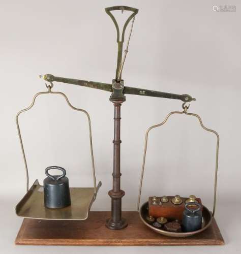 Large grocery scale with various weights. Circa 1900.
