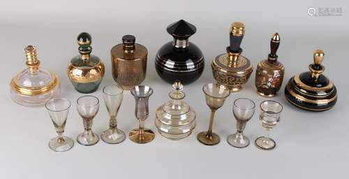 Eight times various stopper bottles, most with gold rim