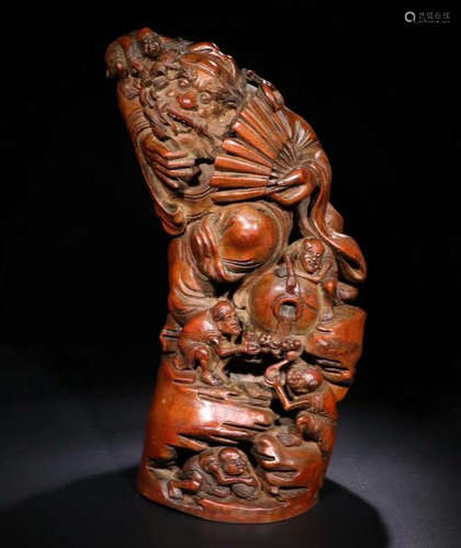 A BAMBOO CARVED FIGURE SHAPED PENDANT