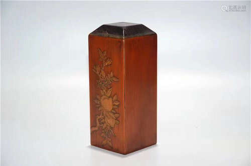 A RED WOOD CARVED BAMBOO DECORATED SEAL