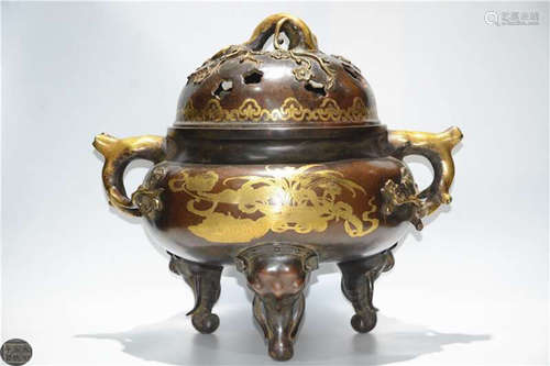 A GILT BRONZE CASTED DOUBLE EAR TRIPOD CENSER