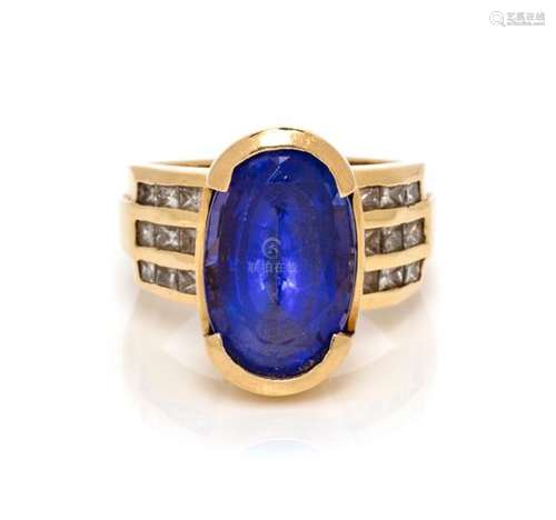 * A 14 Karat Yellow Gold, Tanzanite and Diamond Ring,