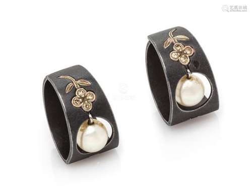 * A Pair of Art Moderne Blackened Steel, White Gold,