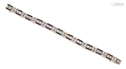 An Art Deco Platinum, Diamond and Onyx Bracelet, 12.23