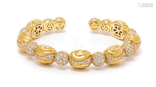 * An 18 Karat Yellow Gold and Diamond Semi-Flexible