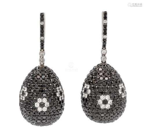 A Pair of 18 Karat White Gold, Diamond and Black