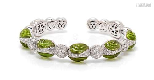 * An 18 Karat White Gold, Peridot and Diamond