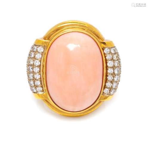 An 18 Karat Yellow Gold, Angel Skin Coral and Diamond