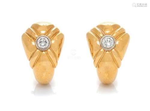 A Pair of 18 Karat Yellow Gold and Diamond Earclips,