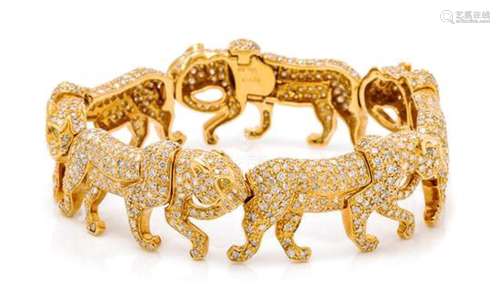 * An 18 Karat Yellow Gold, Diamond and Colored Diamond