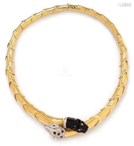 An 18 Karat Bicolor Gold, Diamond, Onyx, Emerald and