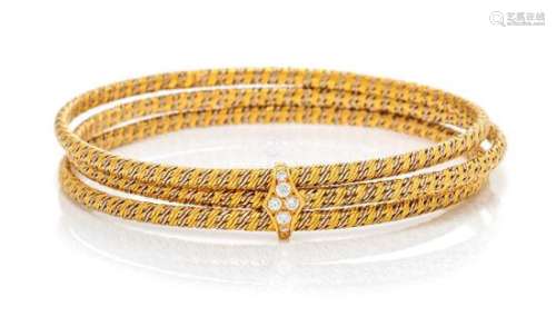 A Bicolor Gold and Diamond Bangle Bracelet, 28.00 dwts.